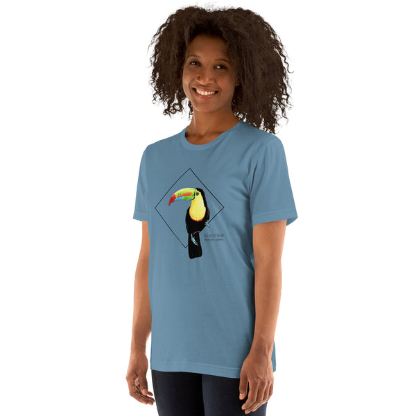 Product mockup showing a female model wearing the keel-billed toucan shirt in the colour steel blue.