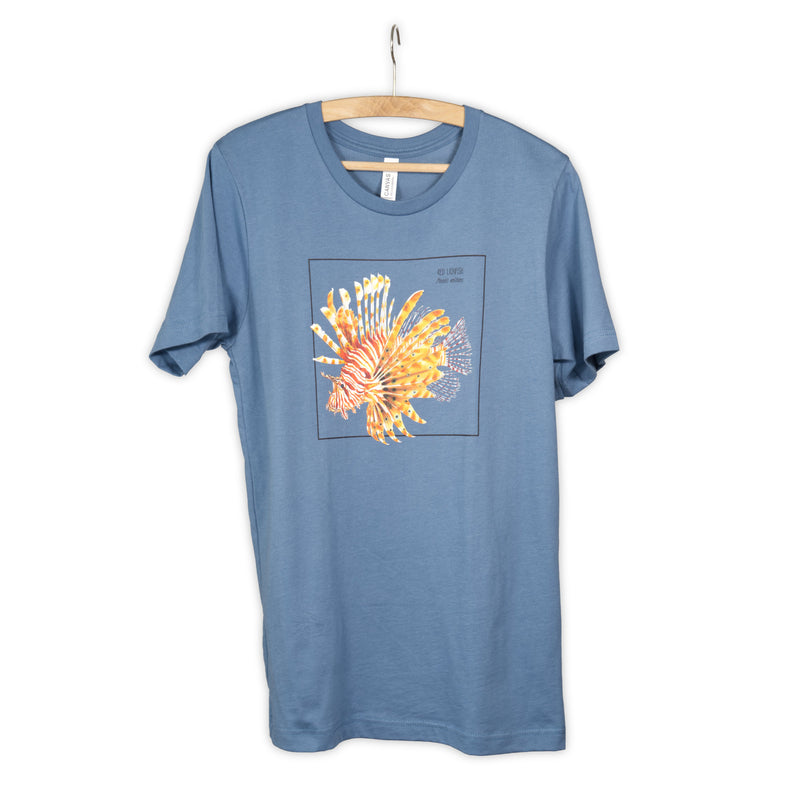Photo of our steel blue t-shirt with a stunning red lionfish print on a wooden hanger.